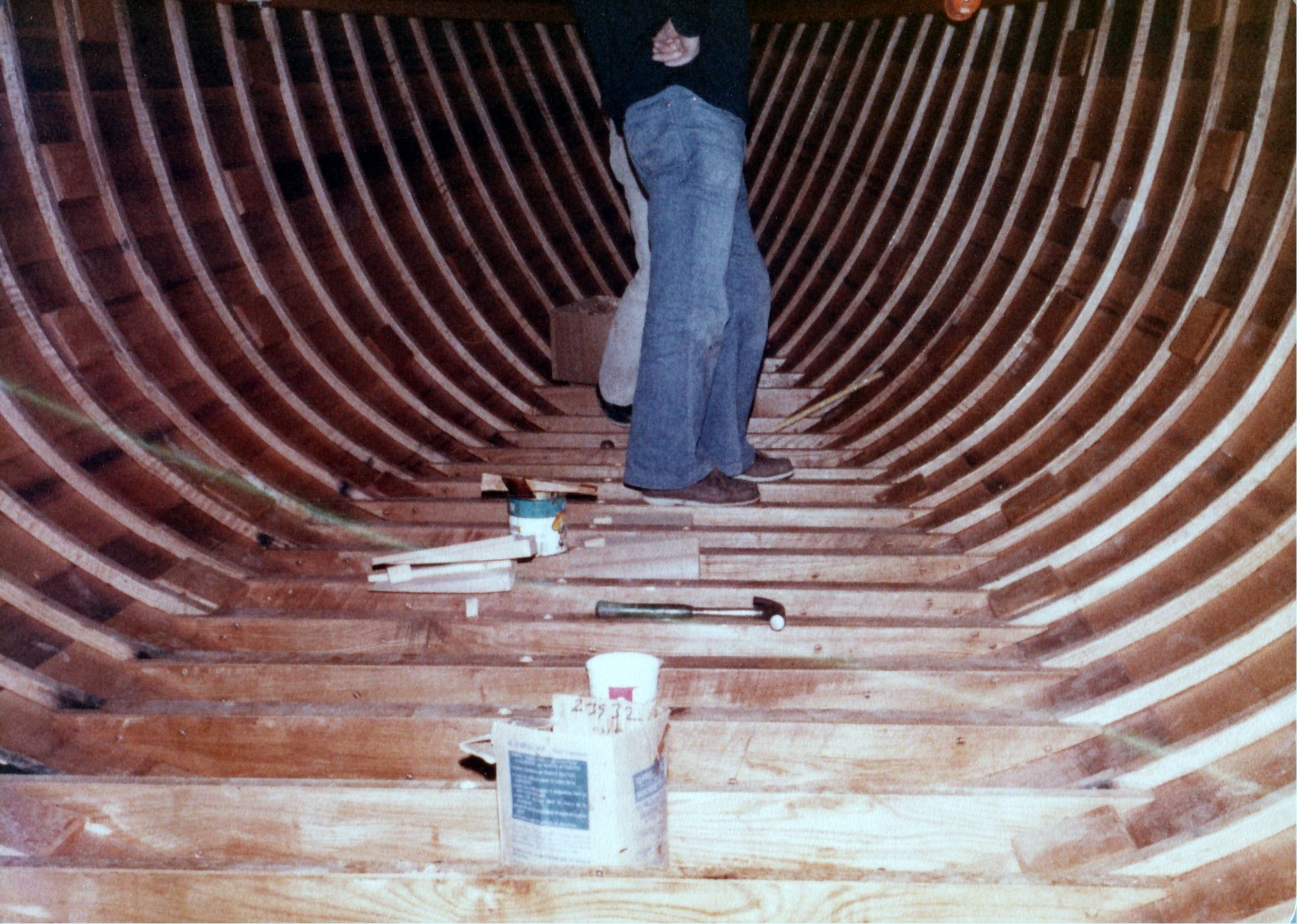 A man standing in the hull among the floors