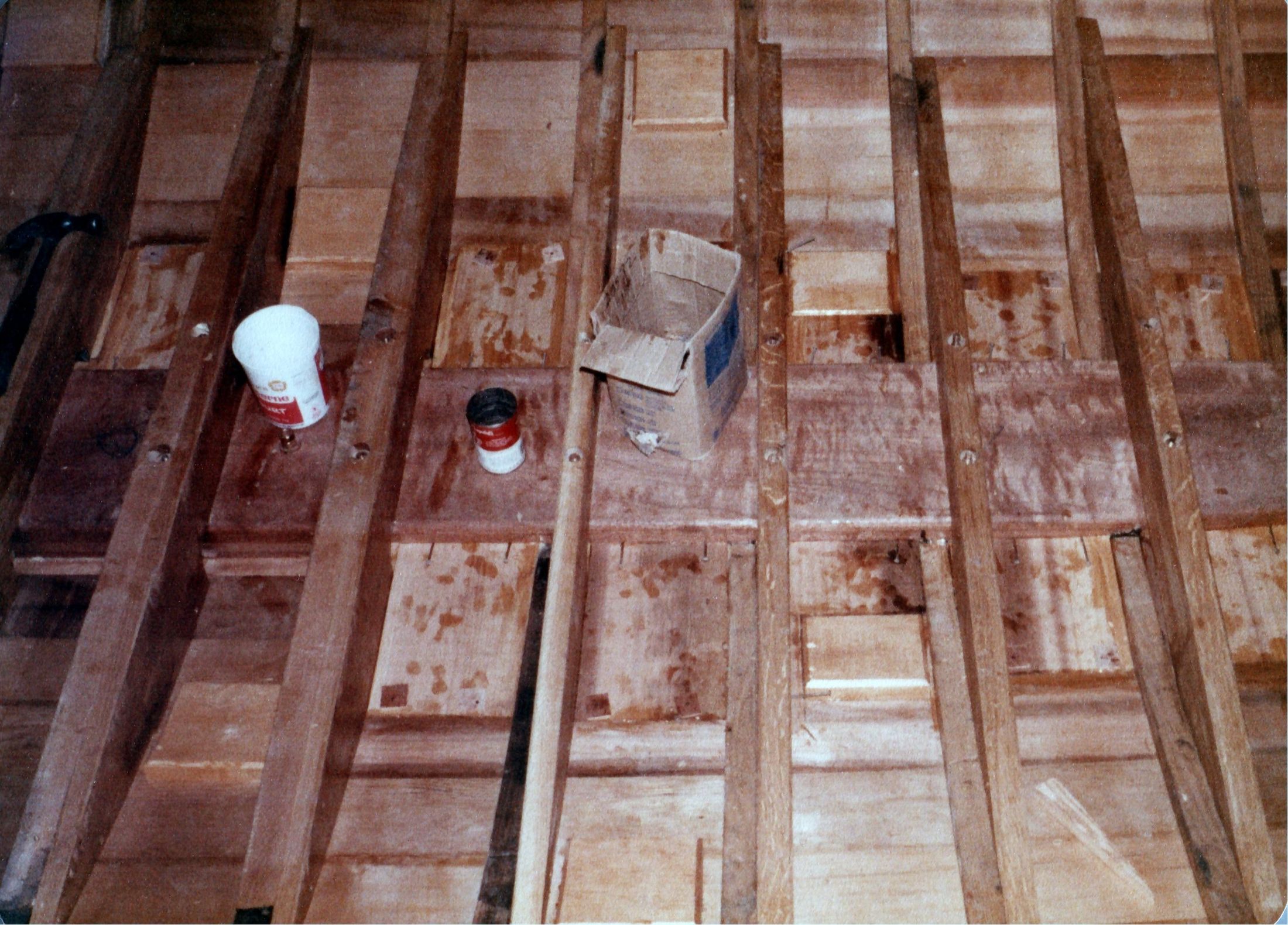 Floors and frames along the bilge, paint cans on the planking