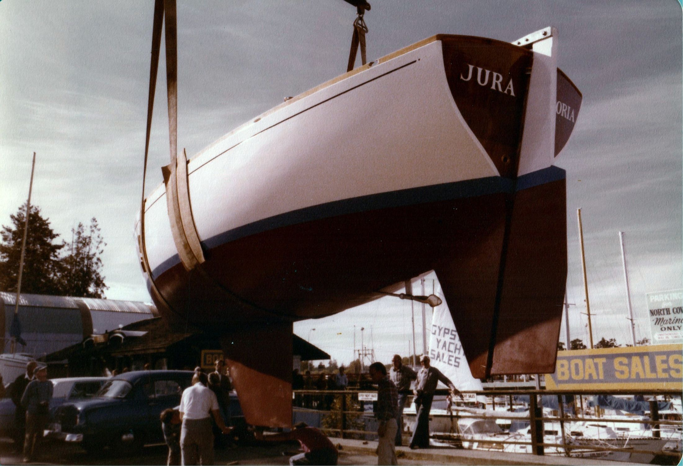 Jura in crane slings at the yard, the name on the transom